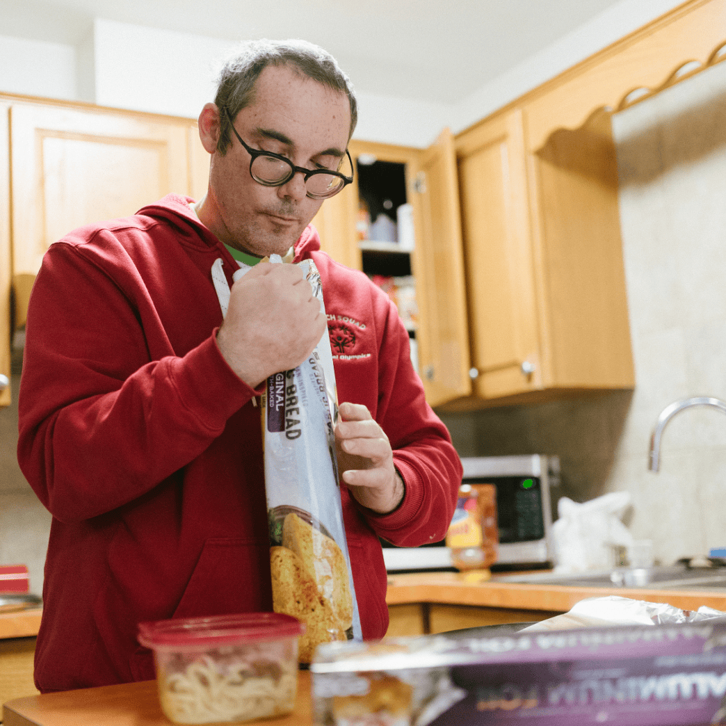 man in kitchen preparng meal