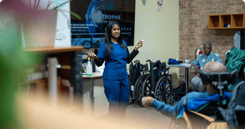 A nurse talking to a group of people