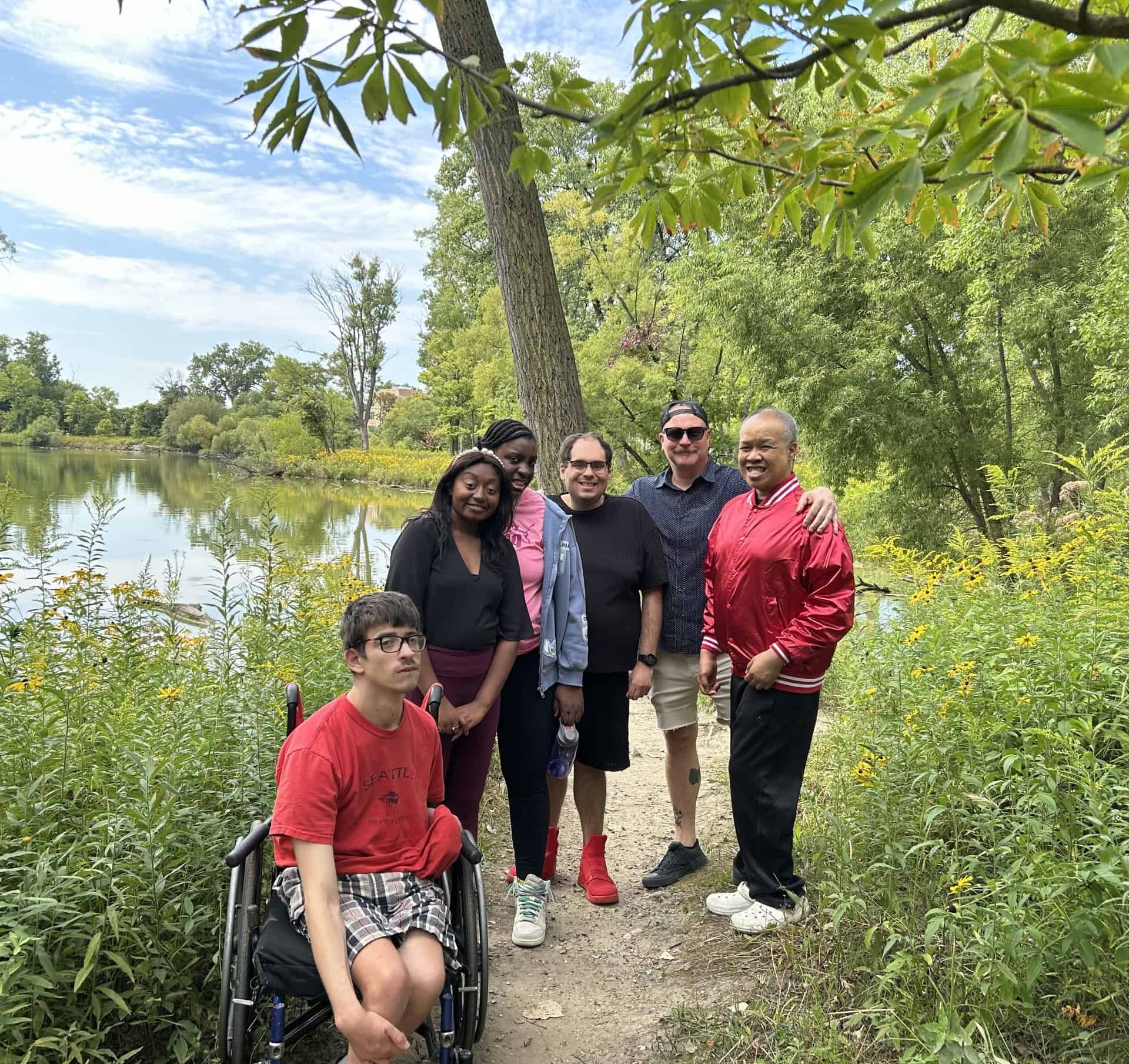 A group of people on a hike at West Ridge Nature Park